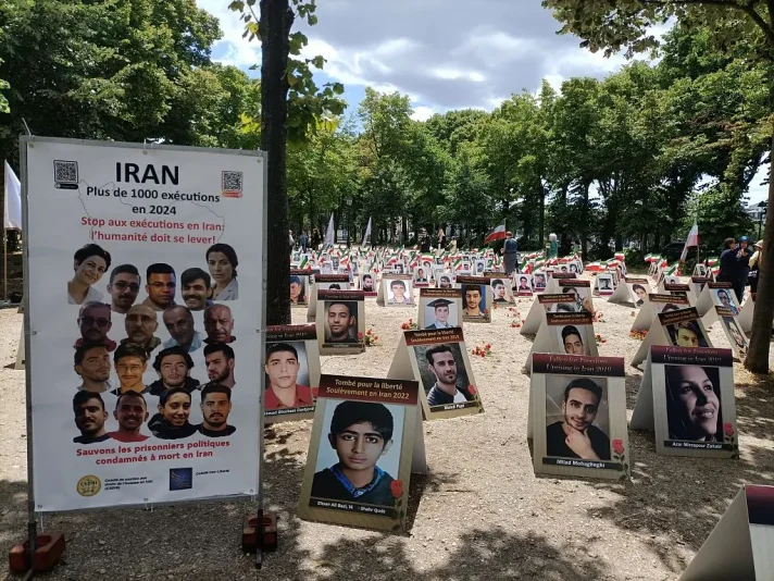 Portraits of slain Iranians are displayed in an area of Esplanades des Invalides in Paris on July 8, 2025, as part of a campaign led by Comite Iran Liberte and Comite de Soutien aux droits de l'homme en Iran (CSDHI) to stop executions in the Islamic republic. (Photo by Delphine TOUITOU / AFP) (Photo by DELPHINE TOUITOU/AFP via Getty Images)