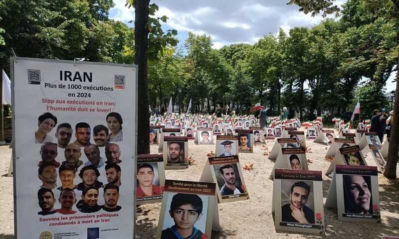 Portraits of slain Iranians are displayed in an area of Esplanades des Invalides in Paris on July 8, 2025, as part of a campaign led by Comite Iran Liberte and Comite de Soutien aux droits de l'homme en Iran (CSDHI) to stop executions in the Islamic republic. (Photo by Delphine TOUITOU / AFP) (Photo by DELPHINE TOUITOU/AFP via Getty Images)
