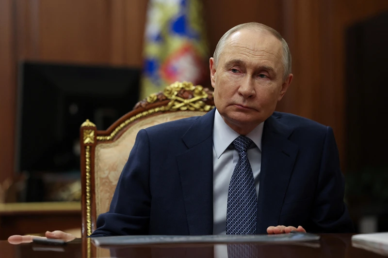 In this pool photograph distributed by the Russian state agency Sputnik, Russia's President Vladimir Putin meets with German Gref, the CEO of Russia's largest Sber bank, in Moscow on July 29, 2025. (Photo by Mikhail METZEL / POOL / AFP) (Photo by MIKHAIL METZEL/POOL/AFP via Getty Images)