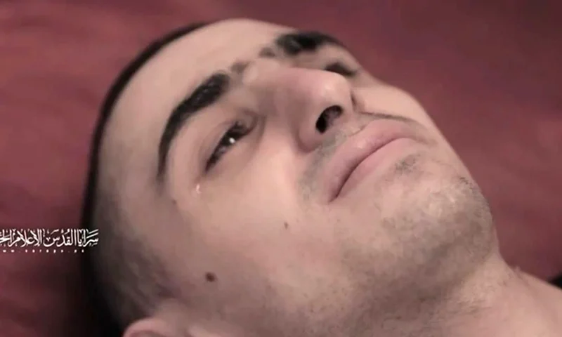 This screengrab from a video released on July 31 by Al-Quds Brigades, the armed wing of Palestinian militant group Islamic Jihad shows a hostage, identified as Rom Braslavski by the Hostages and Missing Families Forum, who was abducted to Gaza in October 2023 during the attack that sparked the Gaza war. Israel said on August 3 the plight of hostages held in Gaza should top the global agenda, after Palestinian militants released videos showing them looking emaciated, heightening fears for their lives after nearly 22 months in captivity. (Photo by Islamic Jihad Media Office / AFP) / ATTN CLIENTS: VIDEO FILMED UNDER DURESS. FAMILY HAS GIVEN PERMISSION FOR THIS SCREENGRAB TO BE USED BY THE MEDIA, THE HOSTAGES FAMILIES FORUM CAMPAIGN GROUP SAID IN A STATEMENT --BEST QUALITY AVAILABLE-- / XGTY / RESTRICTED TO EDITORIAL USE - NO MARKETING NO ADVERTISING CAMPAIGNS - DISTRIBUTED AS A SERVICE TO CLIENTS / (Photo by -/Islamic Jihad Media Office/AFP via Getty Images)