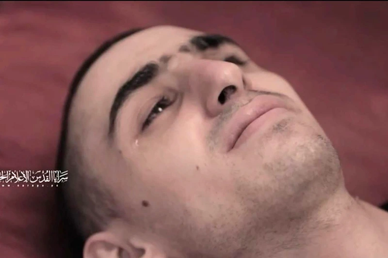 This screengrab from a video released on July 31 by Al-Quds Brigades, the armed wing of Palestinian militant group Islamic Jihad shows a hostage, identified as Rom Braslavski by the Hostages and Missing Families Forum, who was abducted to Gaza in October 2023 during the attack that sparked the Gaza war. Israel said on August 3 the plight of hostages held in Gaza should top the global agenda, after Palestinian militants released videos showing them looking emaciated, heightening fears for their lives after nearly 22 months in captivity. (Photo by Islamic Jihad Media Office / AFP) / ATTN CLIENTS: VIDEO FILMED UNDER DURESS. FAMILY HAS GIVEN PERMISSION FOR THIS SCREENGRAB TO BE USED BY THE MEDIA, THE HOSTAGES FAMILIES FORUM CAMPAIGN GROUP SAID IN A STATEMENT --BEST QUALITY AVAILABLE-- / XGTY / RESTRICTED TO EDITORIAL USE - NO MARKETING NO ADVERTISING CAMPAIGNS - DISTRIBUTED AS A SERVICE TO CLIENTS / (Photo by -/Islamic Jihad Media Office/AFP via Getty Images)