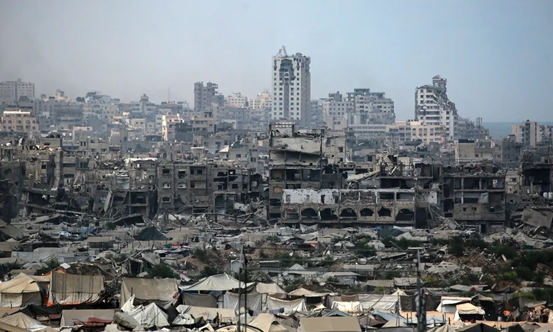 Tents used as temporary shelters by displaced Palestinians are set up near war-damaged buildings in Gaza City on August 8, 2025. Israel's military will "take control" of Gaza City under a plan proposed by Prime Minister Benjamin Netanyahu and approved by his security cabinet, triggered a wave of criticism from across the world. (Photo by Bashar TALEB / AFP) (Photo by BASHAR TALEB/AFP via Getty Images)