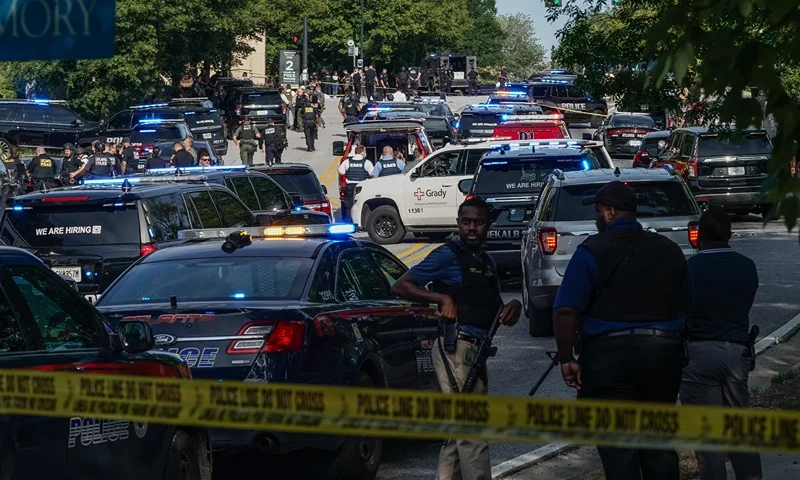 : Law enforcement is seen near the Centers For Disease Control (CDC) Global Headquarters during an active shooter incident on August 8, 2025 in Atlanta, Georgia. According to the Atlanta Police Department, the suspect in the active shooter situation is dead and a police officer was injured. (Photo by Elijah Nouvelage/Getty Images)