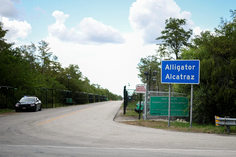 OCHOPEE, FLORIDA - AUGUST 03: The entrance to the state-managed immigration detention center dubbed Alligator Alcatraz, located at the Dade-Collier Training and Transition Airport in the Florida Everglades on August 03, 2025 in Ochopee, Florida. Faith leaders led prayer for those being held within the facility. (Photo by Joe Raedle/Getty Images)