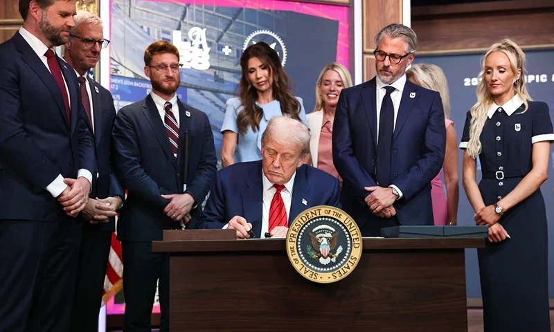 U.S. President Donald Trump signs an executive order during a ceremony in the South Court Auditorium in the Eisenhower Executive Office Building on August 5, 2025 in Washington, DC. The executive order creates a White House task force to help coordinate logistical issues related to the 2028 Summer Olympic Games in Los Angeles including security, visas for athletes and coaches and transportation. (Photo by Win McNamee/Getty Images)