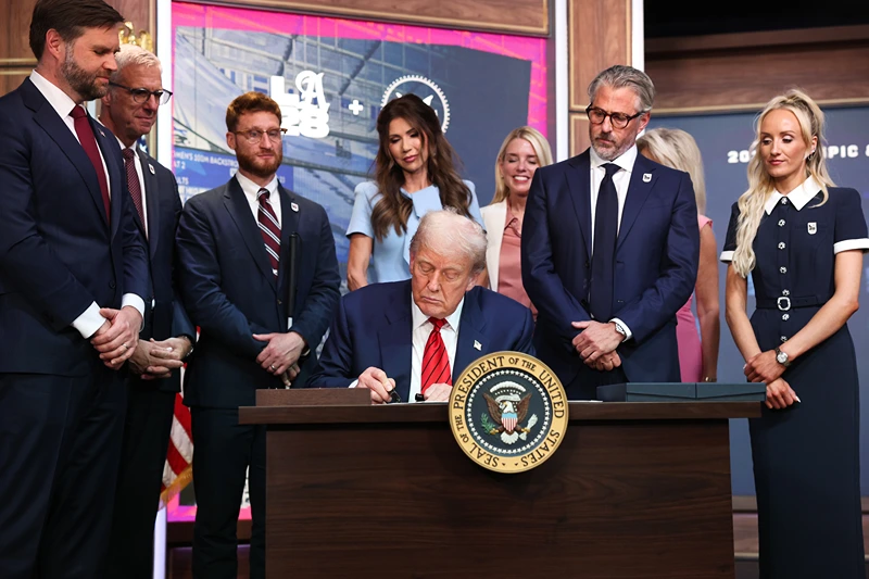 U.S. President Donald Trump signs an executive order during a ceremony in the South Court Auditorium in the Eisenhower Executive Office Building on August 5, 2025 in Washington, DC. The executive order creates a White House task force to help coordinate logistical issues related to the 2028 Summer Olympic Games in Los Angeles including security, visas for athletes and coaches and transportation. (Photo by Win McNamee/Getty Images)