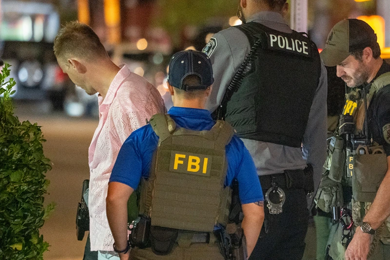 FBI and Border Patrol officers arrest a man, after he assaulted law enforcement with a sandwich, along the U Street corridor during a federal law enforcement deployment to the nation's capital on August 10, 2025 in Washington, DC. U.S. President Donald Trump ordered an increased presence of federal law enforcement to Washington, DC in an effort to curb crime. (Photo by Andrew Leyden/Getty Images)
