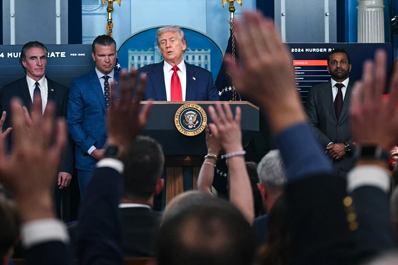 US President Donald Trump, alongside L/R Secretary of the Interior Doug Burgum, Secretary of Defense Pete Hegseth, and FBI Director Kash Patel, speaks during a news conference to discuss crime in Washington, DC, in the Brady Press Briefing Room at the White House in Washington, DC, on August 11, 2025. President Donald Trump announced Monday that he was deploying National Guard troops and putting the Washington police force under federal control to tackle crime in the US capital. "This is Liberation Day in DC, and we're going to take our capital back," Trump said at a White House press conference. (Photo by ANDREW CABALLERO-REYNOLDS / AFP) (Photo by ANDREW CABALLERO-REYNOLDS/AFP via Getty Images)