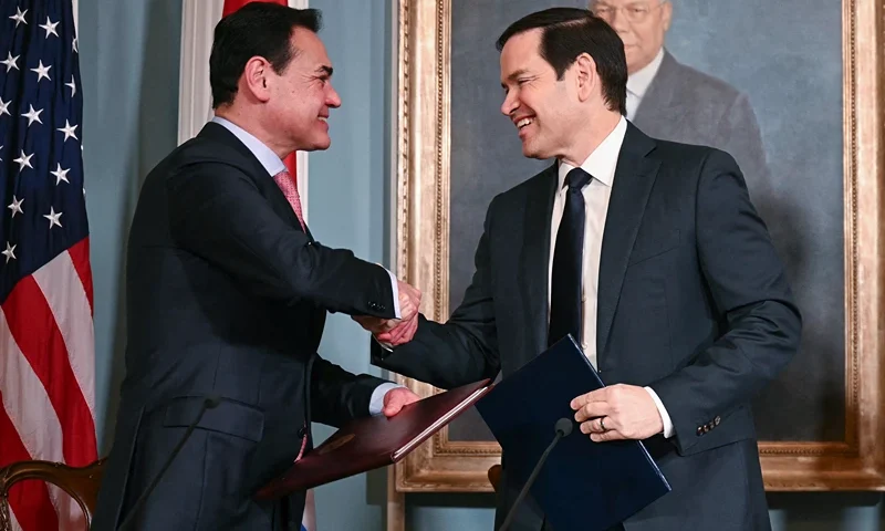 US Secretary of State Marco Rubio (C) and Foreign Minister of Paraguay Ruben Ramirez Lezcano (L) shake hands after signing a memorandum of understanding in the Treaty Room of the State Department in Washington, DC, on August 14, 2025. They are joined by US Deputy Secretary of Homeland Security Troy Edgar (R). (Photo by Jim WATSON / AFP) (Photo by JIM WATSON/AFP via Getty Images)