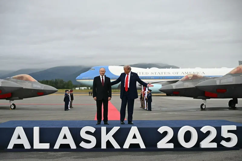 US President Donald Trump (R) and Russian President Vladimir Putin pose on a podium on the tarmac after they arrived at Joint Base Elmendorf-Richardson in Anchorage, Alaska, on August 15, 2025. Putin is in Alaska at the invitation of Trump in his first visit to a Western country since he ordered the 2022 invasion of Ukraine that has killed tens of thousands of people. (Photo by ANDREW CABALLERO-REYNOLDS / AFP) (Photo by ANDREW CABALLERO-REYNOLDS/AFP via Getty Images)