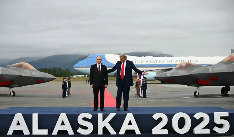 US President Donald Trump (R) and Russian President Vladimir Putin pose on a podium on the tarmac after they arrived at Joint Base Elmendorf-Richardson in Anchorage, Alaska, on August 15, 2025. Putin is in Alaska at the invitation of Trump in his first visit to a Western country since he ordered the 2022 invasion of Ukraine that has killed tens of thousands of people. (Photo by ANDREW CABALLERO-REYNOLDS / AFP) (Photo by ANDREW CABALLERO-REYNOLDS/AFP via Getty Images)