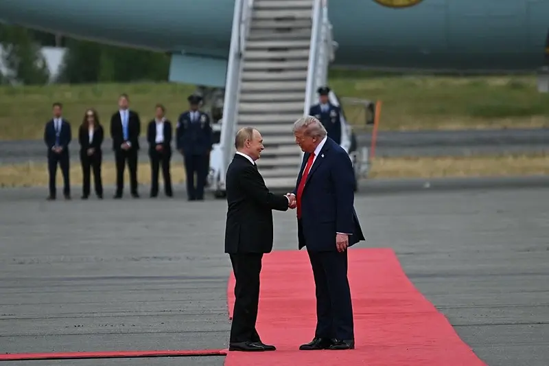 US President Donald Trump greets Russian President Vladimir Putin on the tarmac after they arrived at Joint Base Elmendorf-Richardson in Anchorage, Alaska, on August 15, 2025. Putin is in Alaska at the invitation of Trump in his first visit to a Western country since he ordered the 2022 invasion of Ukraine that has killed tens of thousands of people. (Photo by ANDREW CABALLERO-REYNOLDS / AFP) (Photo by ANDREW CABALLERO-REYNOLDS/AFP via Getty Images)