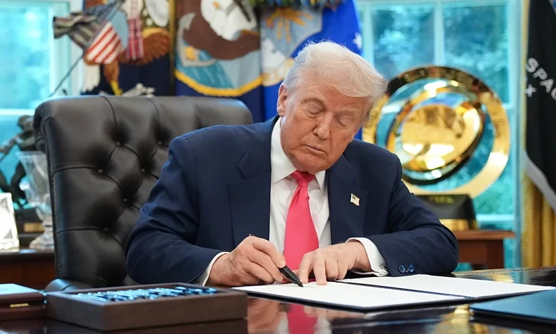 U.S. President Donald Trump signs a proclamation in the Oval Office with Frank Bisignano (L), Administrator of the Social Security Administration, on August 14, 2025 in Washington, DC. Trump signed the proclamation on the 90th anniversary of Social Security and highlight his administration's efforts on the program. (Photo by Andrew Harnik/Getty Images)