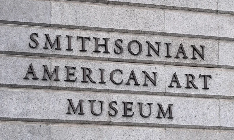 The Smithsonian American Art Museum sign is seen in Washington, DC on August 14, 2025. US President Donald Trump on Tuesday criticized top museums for their "woke" focus on subjects including "how bad Slavery was," his latest attack on the cultural institutions in a country that fought a civil war over the issue. (Photo by Alex WROBLEWSKI / AFP) (Photo by ALEX WROBLEWSKI/AFP via Getty Images)