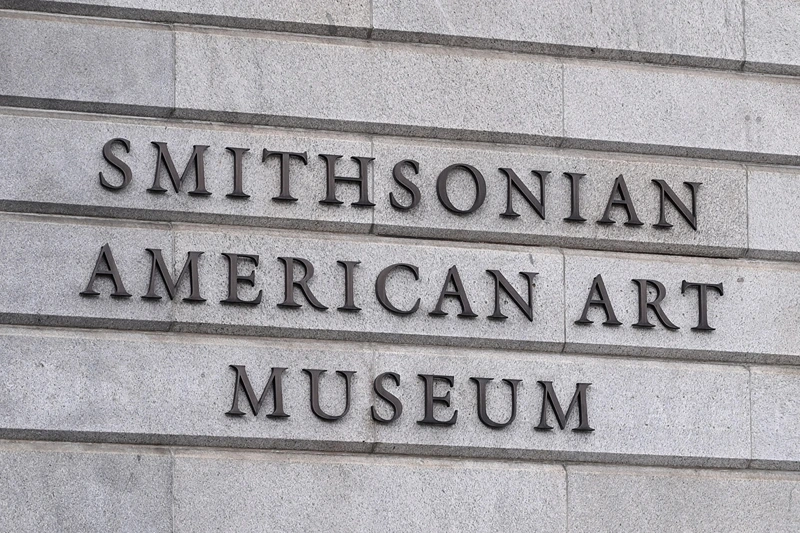 The Smithsonian American Art Museum sign is seen in Washington, DC on August 14, 2025. US President Donald Trump on Tuesday criticized top museums for their "woke" focus on subjects including "how bad Slavery was," his latest attack on the cultural institutions in a country that fought a civil war over the issue. (Photo by Alex WROBLEWSKI / AFP) (Photo by ALEX WROBLEWSKI/AFP via Getty Images)