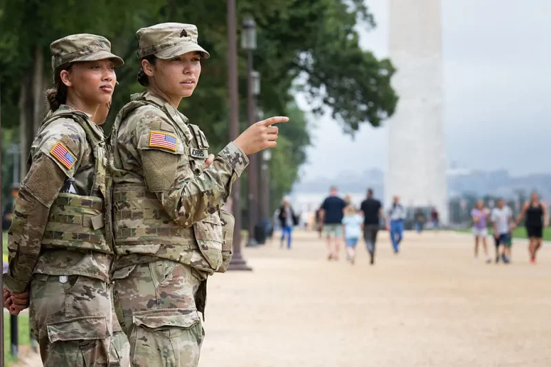 Members of the National Guard patrol on the National Mall near the US Capitol in Washington, DC, on August 20, 2025. US President Donald Trump on August 11 deployed military and federal law enforcement to curb violent crime in Washington, as he seeks to make good on his campaign pledge to be a "law and order" president. The Republican leader said he would place the city's Metropolitan Police under federal government control while also sending the National Guard onto the streets of the US capital. (Photo by SAUL LOEB / AFP) (Photo by SAUL LOEB/AFP via Getty Images)
