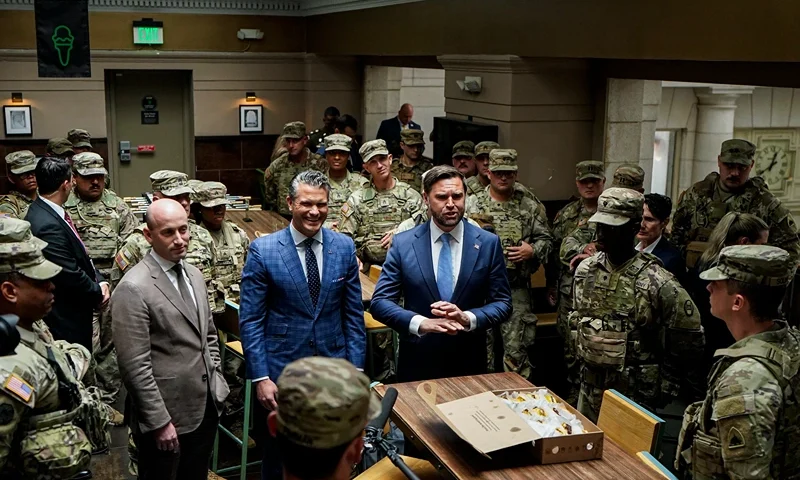 WASHINGTON, DC - AUGUST 20: (L-R) White House Deputy Chief of Staff Stephen Miller, Defense Secretary Pete Hegseth, and Vice President JD Vance speak with members of the National Guard during a visit to Union Station on August 20, 2025 in Washington, D.C. The Trump administration has deployed federal officers and the National Guard to the District in order to place the DC Metropolitan Police Department under federal control and assist in crime prevention in the nation's capital. (Photo by Al Drago-Pool/Getty Images)