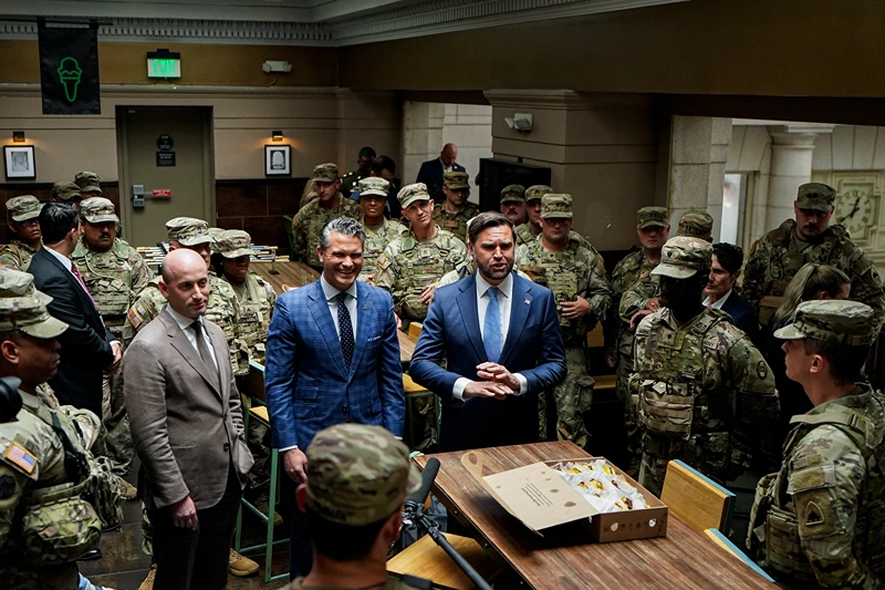 WASHINGTON, DC - AUGUST 20: (L-R) White House Deputy Chief of Staff Stephen Miller, Defense Secretary Pete Hegseth, and Vice President JD Vance speak with members of the National Guard during a visit to Union Station on August 20, 2025 in Washington, D.C. The Trump administration has deployed federal officers and the National Guard to the District in order to place the DC Metropolitan Police Department under federal control and assist in crime prevention in the nation's capital. (Photo by Al Drago-Pool/Getty Images)