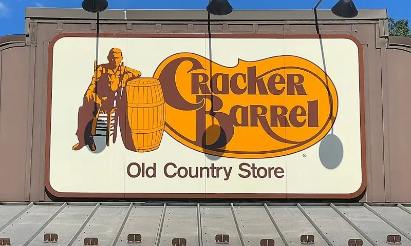 The Cracker Barrel Old Country Store logo is displayed on a large rooftop sign in Mount Arlington, New Jersey, on August 22, 2025. Cracker Barrel has a special place in the hearts of many Americans, offering country cuisine in a folksy "Old Country Store" setting complete with rocking chairs and occasional country music performances. But an attempt to rebrand the storied US chain has sparked a firestorm of opposition online and opened a new front in the culture wars around legacy brands seeking to update their corporate images (Photo by Gregory WALTON / AFP) (Photo by GREGORY WALTON/AFP via Getty Images)