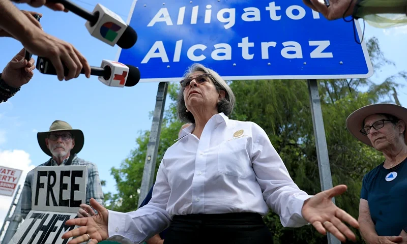OCHOPEE, FLORIDA - AUGUST 22: Miami-Dade County Mayor Daniella Levine Cava speaks to the media at the entrance to "Alligator Alcatraz" at the Dade-Collier Training and Transition Airport on August 22, 2025 in Ochopee, Florida. The mayor spoke about her support for a decision by a federal judge that ordered an indefinite halt to new construction at the immigration detention facility, and barred any new detainees from being brought to the site, siding with environmental groups who said the facility is endangering the Everglades and its wildlife. The state of Florida filed notice of appeal after the judge's ruling. (Photo by Joe Raedle/Getty Images)