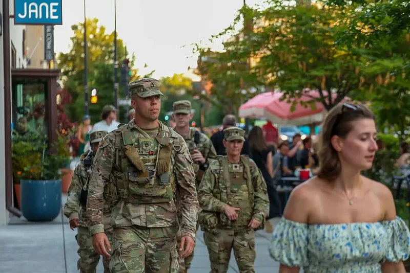 WASHINGTON, DC - AUGUST 22: Members of the National Guard patrol the 14 Street restaurant and nightlife area on August 22, 2025 in Washington, DC. An increased presence of law enforcement has been seen throughout the nation's capital since U.S. President Donald Trump announced plans to deploy federal officers and the U.S. National Guard. (Photo by Tasos Katopodis/Getty Images)