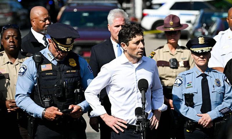 MINNEAPOLIS, MINNESOTA - AUGUST 27: Minneapolis Mayor Jacob Frey (C) speaks to the media following a mass shooting at Annunciation Catholic School on August 27, 2025 in Minneapolis, Minnesota. According to Minneapolis Police, a gunman fired through the windows of the Annunciation Church at worshippers sitting in pews during a Catholic school Mass, killing two children and injuring at least 17 others. The gunman reportedly died at the scene from a self-inflicted gunshot wound. (Photo by Stephen Maturen/Getty Images)