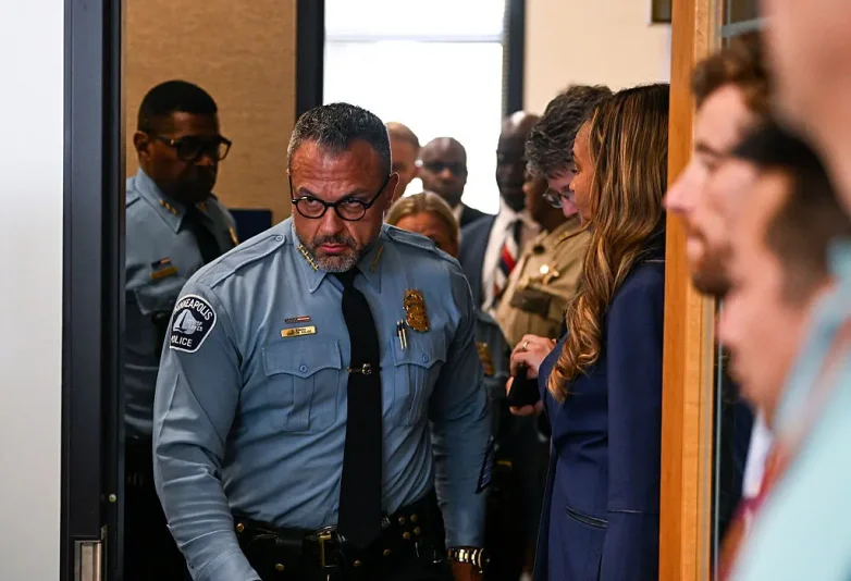 MINNEAPOLIS, MINNESOTA - AUGUST 28: Minneapolis Police Chief Brian O'Hara (C) arrives at a law enforcement briefing following a mass shooting at Annunciation Catholic School on August 28, 2025 in Minneapolis, Minnesota. According to Minneapolis Police, a gunman fired through the windows of the Annunciation Church at worshippers sitting in pews during a Catholic school Mass, killing two children and injuring at least 17 others. The gunman reportedly died at the scene from a self-inflicted gunshot wound. (Photo by Stephen Maturen/Getty Images)
