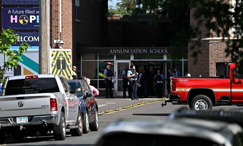 MINNEAPOLIS, MINNESOTA - AUGUST 27: Police work the scene following a mass shooting at Annunciation Catholic School on August 27, 2025 in Minneapolis, Minnesota. According to Minneapolis Police, a gunman fired through the windows of the Annunciation Church at worshippers sitting in pews during a Catholic school Mass, killing two children and injuring at least 17 others. The gunman reportedly died at the scene from a self-inflicted gunshot wound. (Photo by Stephen Maturen/Getty Images)