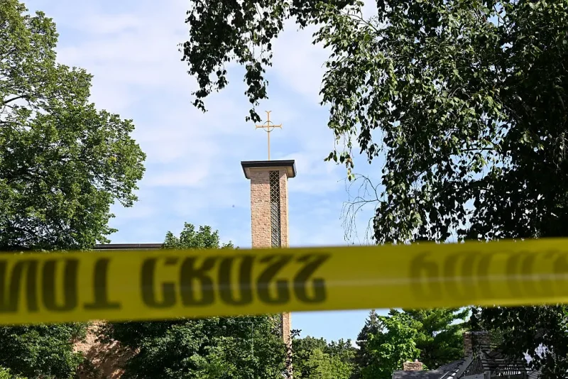 MINNEAPOLIS, MINNESOTA - AUGUST 27: The Annunciation Catholic Church is seen behind police tape following a mass shooting on August 27, 2025 in Minneapolis, Minnesota. According to Minneapolis Police, a gunman fired through the windows of the Annunciation Church at worshippers sitting in pews during a Catholic school Mass, killing two children and injuring at least 17 others. The gunman reportedly died at the scene from a self-inflicted gunshot wound. (Photo by Stephen Maturen/Getty Images)