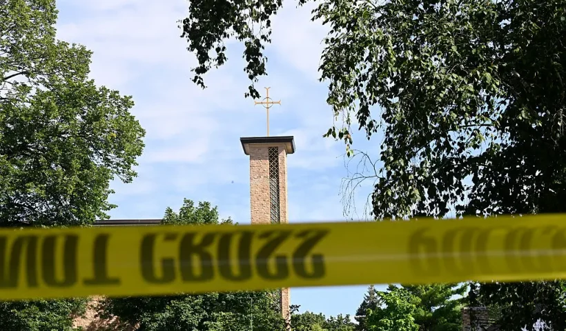 MINNEAPOLIS, MINNESOTA - AUGUST 27: The Annunciation Catholic Church is seen behind police tape following a mass shooting on August 27, 2025 in Minneapolis, Minnesota. According to Minneapolis Police, a gunman fired through the windows of the Annunciation Church at worshippers sitting in pews during a Catholic school Mass, killing two children and injuring at least 17 others. The gunman reportedly died at the scene from a self-inflicted gunshot wound. (Photo by Stephen Maturen/Getty Images)