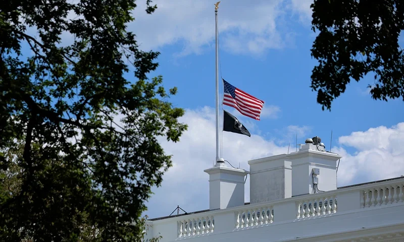 : The U.S. flag is lowered to half-staff above the White House on August 27, 2025 in Washington, DC. President Donald Trump ordered the flags lowered in memorial of the victims of today's mass shooting at a Minneapolis Catholic church and school. (Photo by Chip Somodevilla/Getty Images)