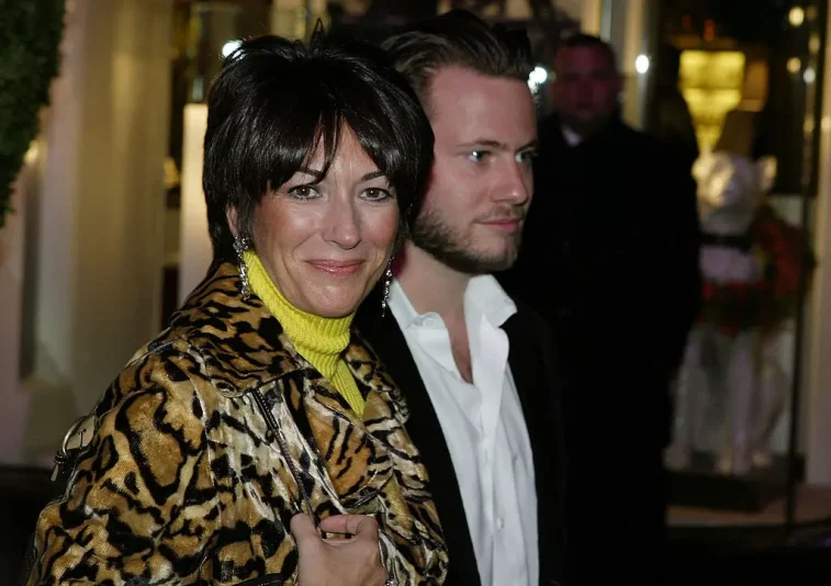 NEW YORK - DECEMBER 8: Socialite Ghislane Maxwell with an unidentified male companion attends the Opening of the Asprey Flagship Store on 5th Avenue December 8, 2003 in New York City. (Photo by Mark Mainz/Getty Images)