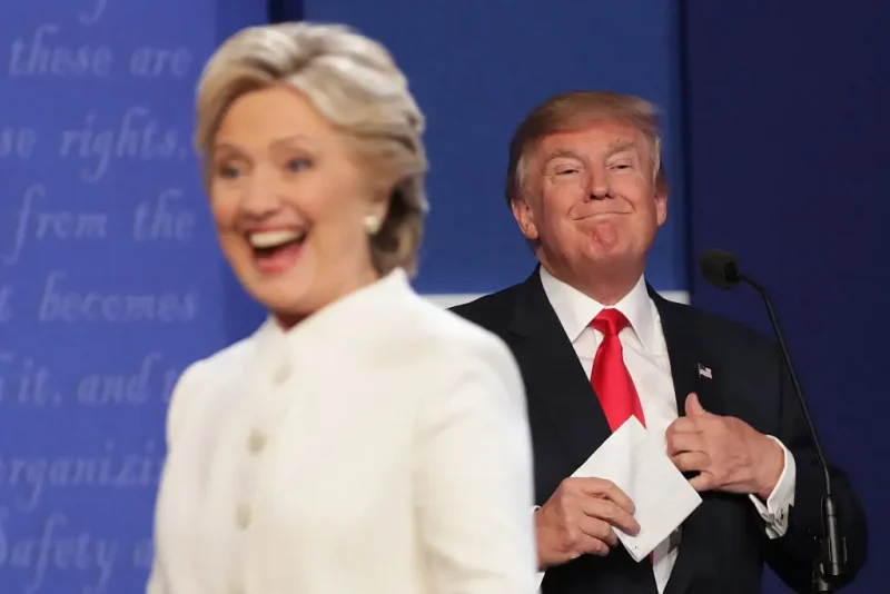 LAS VEGAS, NV - OCTOBER 19: Democratic presidential nominee former Secretary of State Hillary Clinton walks off stage as Republican presidential nominee Donald Trump smiles after the third U.S. presidential debate at the Thomas & Mack Center on October 19, 2016 in Las Vegas, Nevada. Tonight is the final debate ahead of Election Day on November 8. (Photo by Chip Somodevilla/Getty Images)