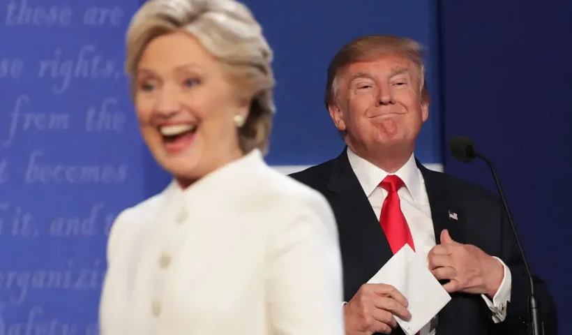 LAS VEGAS, NV - OCTOBER 19: Democratic presidential nominee former Secretary of State Hillary Clinton walks off stage as Republican presidential nominee Donald Trump smiles after the third U.S. presidential debate at the Thomas & Mack Center on October 19, 2016 in Las Vegas, Nevada. Tonight is the final debate ahead of Election Day on November 8. (Photo by Chip Somodevilla/Getty Images)