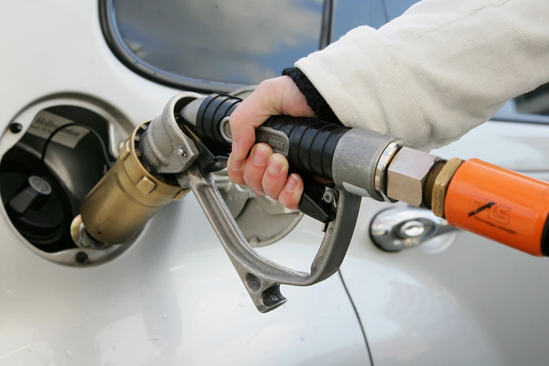 : A woman fills up a gas-tank of a car at a gas filling station on March 19, 2007 in Berlin, Germany. Autogas is the common name for liquified petroleum gas when it is used as a fuel in internal combustion engines in vehicles. Autogas is widely used as a "green" fuel as it decreases exhaust emissions (less 20 percent CO2) (Photo by Andreas Rentz/Getty Images)