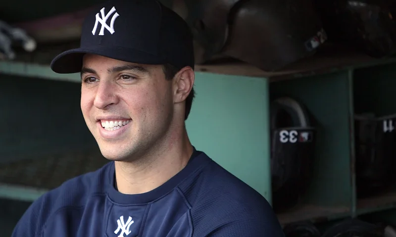 Mark Teixeira #25 of the New York Yankees smiles while talking to reporters before a game against the Boston Red Sox at Fenway Park on May 9, 2010 in Boston, Massachusetts. (Photo by Jim Rogash/Getty Images)