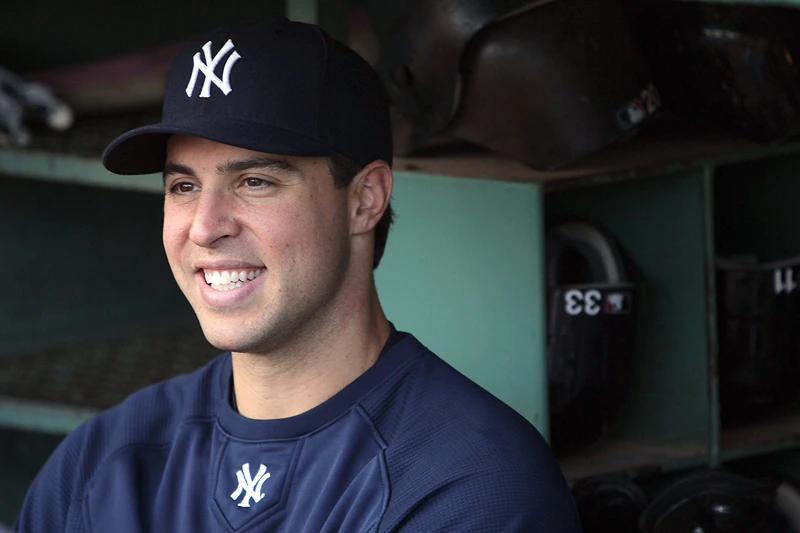 Mark Teixeira #25 of the New York Yankees smiles while talking to reporters before a game against the Boston Red Sox at Fenway Park on May 9, 2010 in Boston, Massachusetts. (Photo by Jim Rogash/Getty Images)