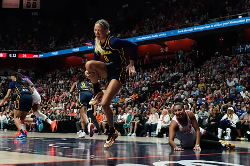 Indiana Fever guard Sophie Cunningham (8) is injured on a play against Connecticut Sun guard Bria Hartley (14) in the first half at Mohegan Sun Arena. Mandatory Credit: David Butler II-Imagn Images