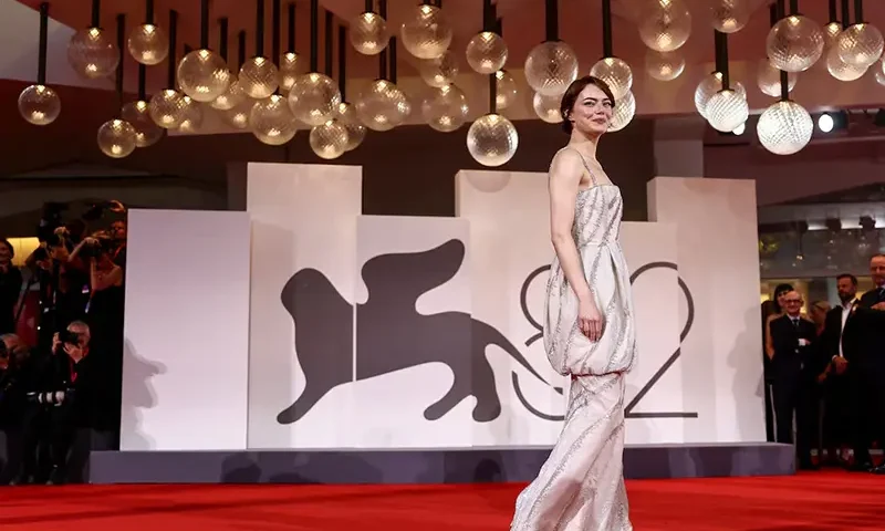 Cast member Emma Stone poses on the red carpet for the screening of the movie "Bugonia" in competition, at the 82nd Venice Film Festival, in Venice, Italy, August 28, 2025. REUTERS/Yara Nardi