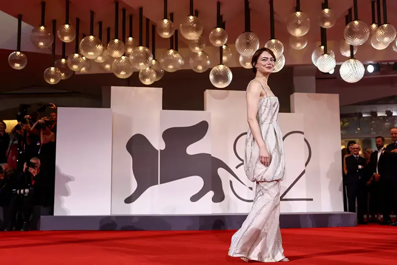 Cast member Emma Stone poses on the red carpet for the screening of the movie "Bugonia" in competition, at the 82nd Venice Film Festival, in Venice, Italy, August 28, 2025. REUTERS/Yara Nardi