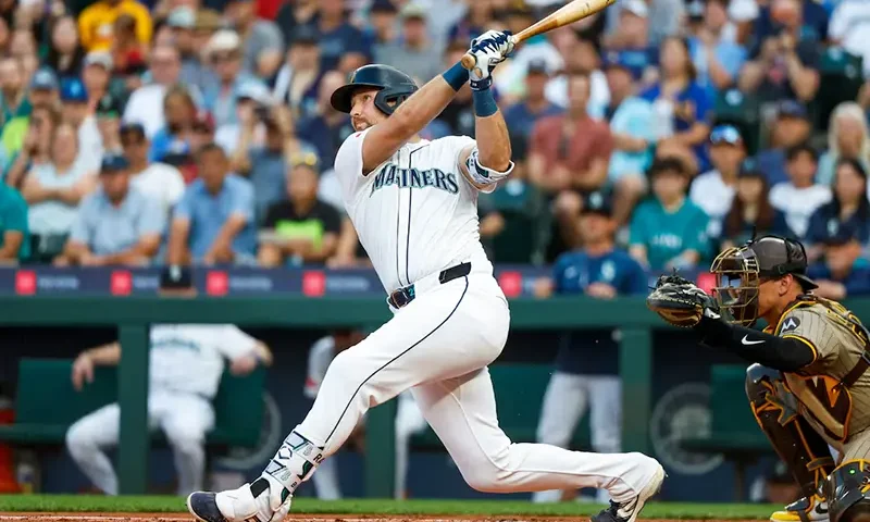 Seattle Mariners catcher Cal Raleigh (29) hits a solo-home run against the San Diego Padres during the first inning at T-Mobile Park. The home run is the 50th of the season for Raleigh. Mandatory Credit: Joe Nicholson-Imagn Images