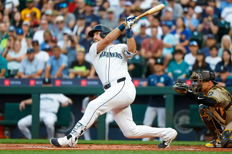 Seattle Mariners catcher Cal Raleigh (29) hits a solo-home run against the San Diego Padres during the first inning at T-Mobile Park. The home run is the 50th of the season for Raleigh. Mandatory Credit: Joe Nicholson-Imagn Images