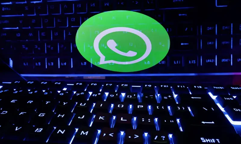 A keyboard is placed in front of a displayed WhatsApp logo in this illustration taken February 21, 2023. REUTERS/Dado Ruvic/Illustration/ File Photo