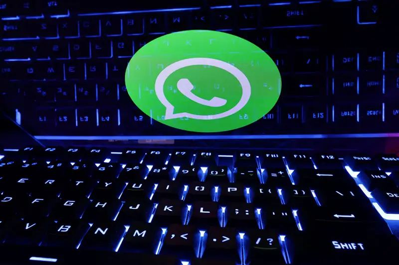 A keyboard is placed in front of a displayed WhatsApp logo in this illustration taken February 21, 2023. REUTERS/Dado Ruvic/Illustration/ File Photo
