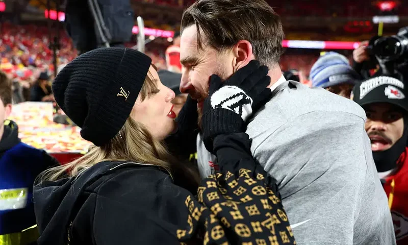 Taylor Swift and Kansas City Chiefs tight end Travis Kelce (87) react after the AFC Championship game against the Buffalo Bills at GEHA Field at Arrowhead Stadium. Mandatory Credit: Mark J. Rebilas-Imagn Images/File Photo