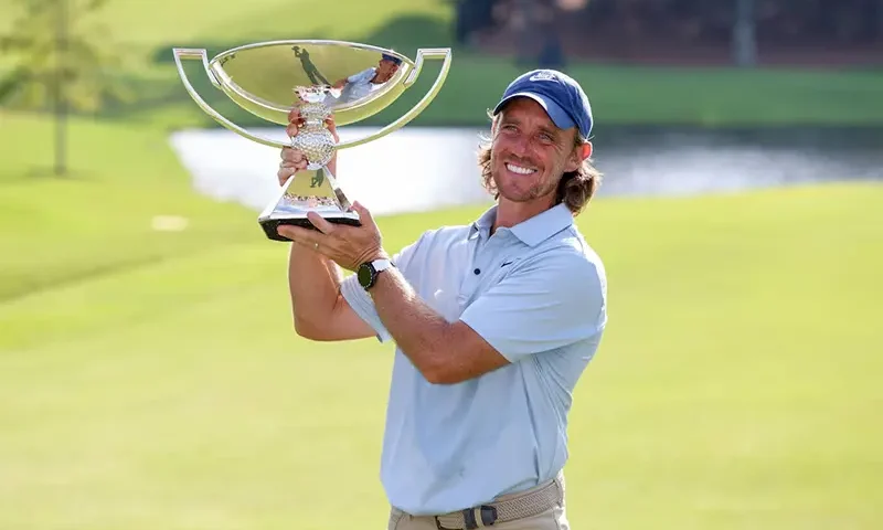 Tommy Fleetwood poses for a photo with the FedExCup Trophy after winning the TOUR Championship golf tournament. Mandatory Credit: Brett Davis-Imagn Images