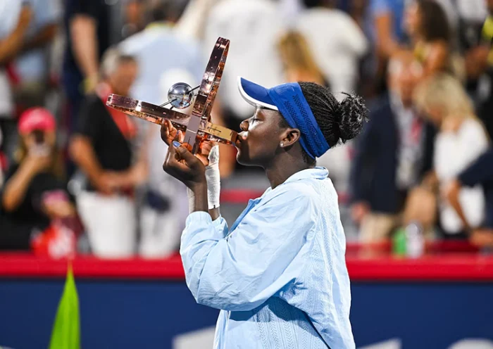Victoria Mboko (CAN) tournament winner against Naomi Osaka (JPN) holds her trophy at IGA Stadium. Mandatory Credit: David Kirouac-Imagn Images