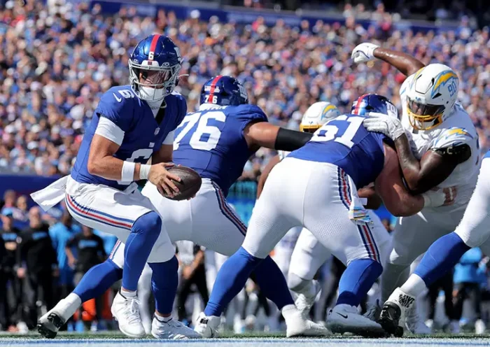 New York Giants quarterback Jaxson Dart (6) takes a snap against the Los Angeles Chargers during the first quarter at MetLife Stadium. Mandatory Credit: Brad Penner-Imagn Images