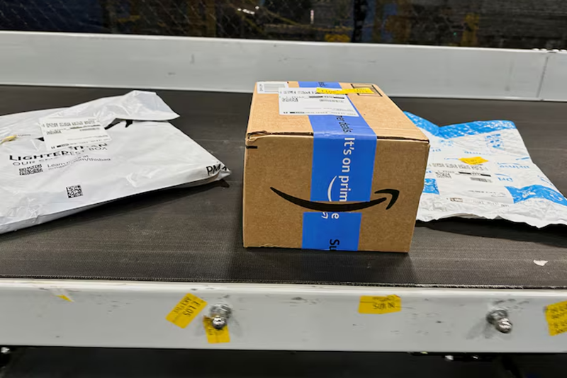 Packages are transported on a conveyor belt at the Amazon warehouse, busy on Prime Day, in Melville, New York, U.S., July 11, 2023. REUTERS/Soren Larson/ File Photo