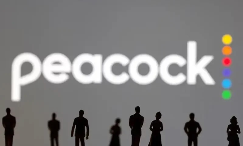Toy figures of people are seen in front of the displayed Peacock logo, in this illustration created on January 20, 2022. REUTERS/Dado Ruvic/Illustration/File Photo